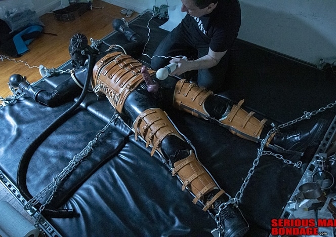 A111_MALEBONDAGE_Edged_Part2of3_SethClaudio_FullBodyTanLeatherBraceAndRubberBackRoom