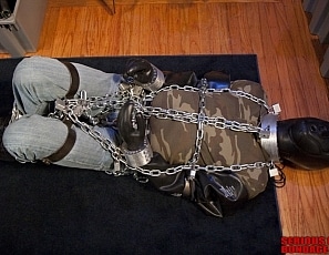 A138_MALEBONDAGE-IOnlyWantedToTryTheHood_EdFelix_ChainedInRigidCuffGearOnFloorBackRoom