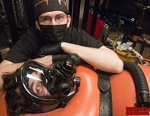 A185_MALEBONDAGE_BreatheWhileYouCan_Part2of3_ShaneDamianJames_OrangeInflatableBagLaptopAndPatientMonitor