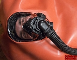 A186_MALEBONDAGE_BreatheWhileYouCan_Part3of3_ShaneDamianJames_OrangeInflatableBagLaptopAndPatientMonitor