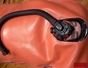A186_MALEBONDAGE_BreatheWhileYouCan_Part3of3_ShaneDamianJames_OrangeInflatableBagLaptopAndPatientMonitor