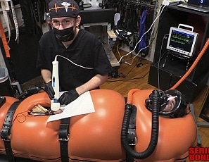 A186_MALEBONDAGE_BreatheWhileYouCan_Part3of3_ShaneDamianJames_OrangeInflatableBagLaptopAndPatientMonitor