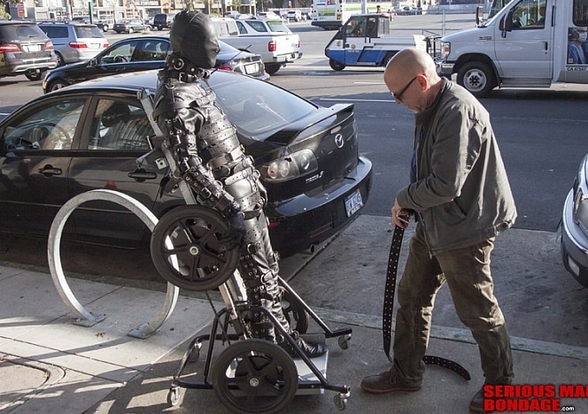 R750_MALEBONDAGE-VerticalWheelchair_RubCopDalton_VisitMotorcycleStoreMrSWickedGrounds