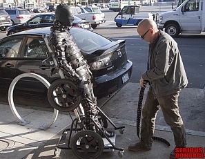 R750_MALEBONDAGE-VerticalWheelchair_RubCopDalton_VisitMotorcycleStoreMrSWickedGrounds