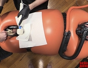 R778_MALEBONDAGE_BreatheWhileYouCan_Part1of3_ShaneDamianJames_OrangeInflatableBagLaptopAndPatientMonitor