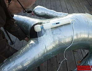 R896_MALEBONDAGE_BoxingGloveMummification_Part1of2_SamDale_GingerbreadMummificationOnDeck