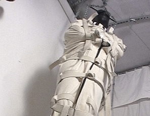 R915_MALEBONDAGE_CanvavasAsylum_LeatherHoodMaxcitaBootSuspendedFrontRoom_KenDale