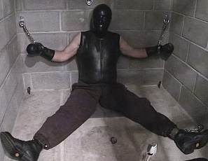 R938_MALEBONDAGE_BondageSittingAtEdgeDungeon_MarkShaneSeth_MarkChainedToWallInSolitaryCell