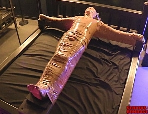 R992_MALEBONDAGE_BoyBlakeMummification_Part1of2_BlakeBobBind_BobsHouseMummificationOverBed
